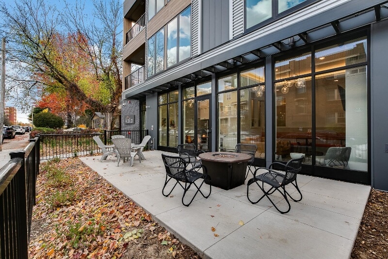 outdoor seating on the street level with a community fire pit